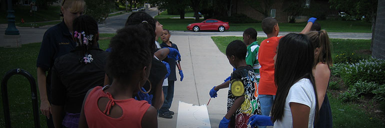 Officer leading a drawing activity