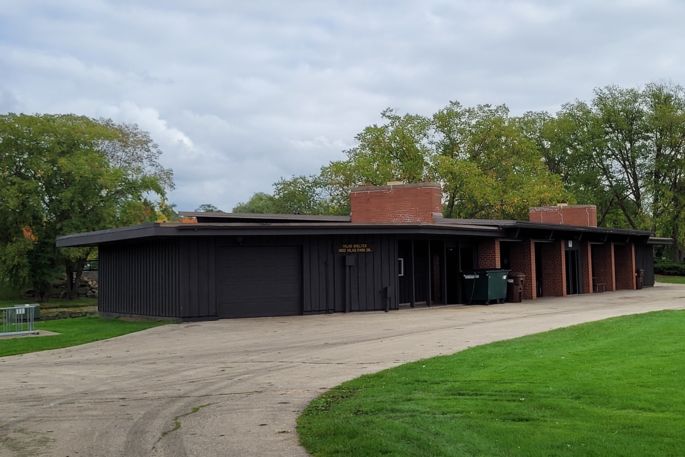 vilas park shelter with paved drive and grass. 