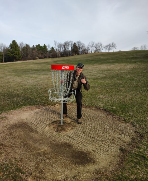 ranger gives thumbs up at new disc golf basket