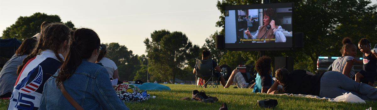 movie playing on outdoor screen