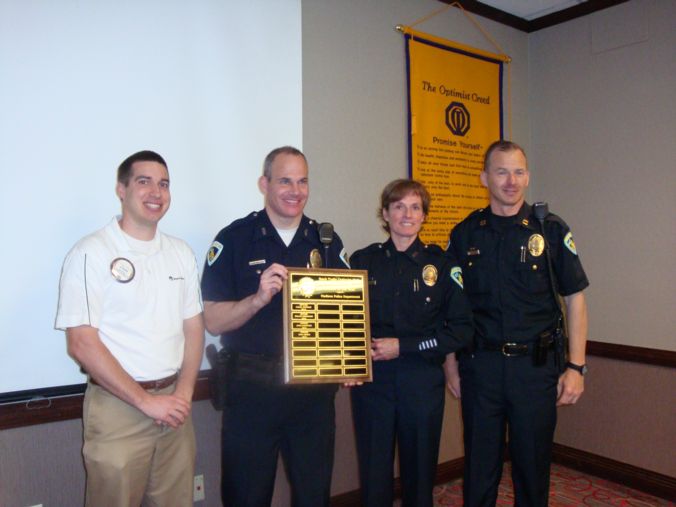 Officers with plaque