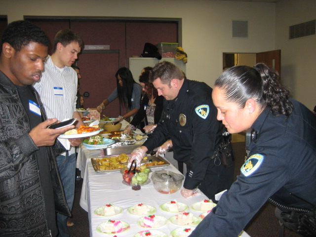 MPD officers help serve food at the community supper