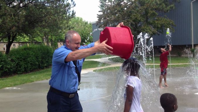 Firefighter with bucket of water