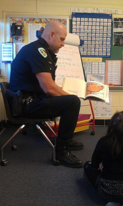 Officer Tim reading "Old Bear"  at Schenk Elementary School