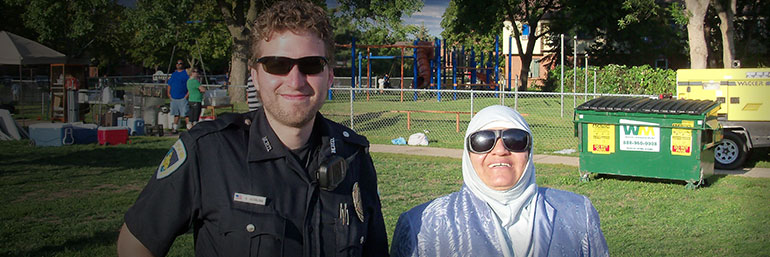 Officer and citizen smiling