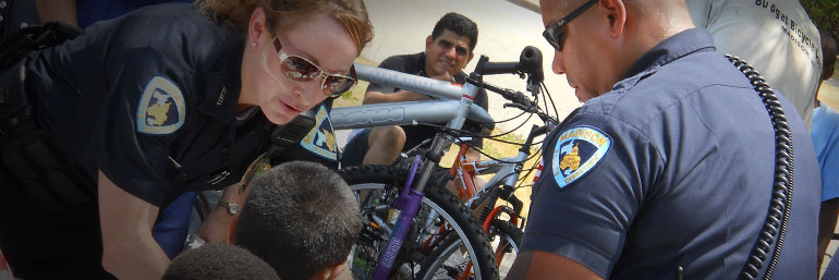 Officers helping a child in an activity