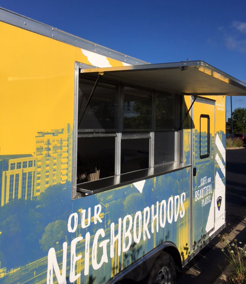 Neighborhood Resource Trailer with serving window open.