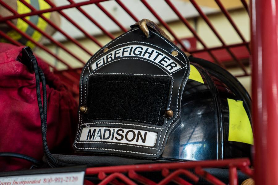 Fire Helmet - Firefighters store their helmets and turnout gear in gear racks located on the apparatus bay floor.