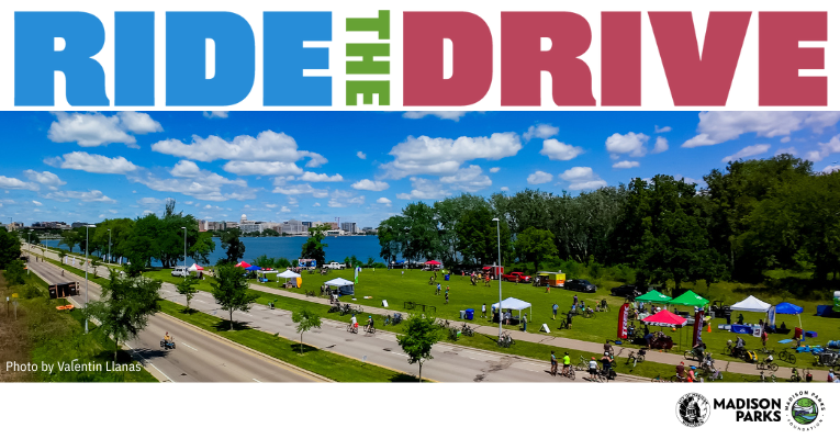 view of John Nolen Drive, Olin Park with people tents, bicyclists,