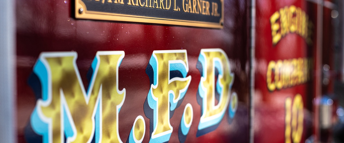 Side of a fire truck with the letters MFD