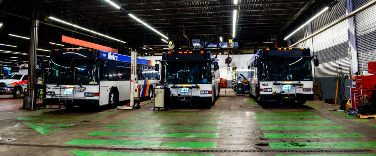 Three buses parked in the Metro service garage