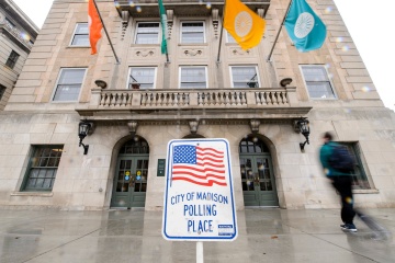 Front doors of the Memorial Union with polling place sign 