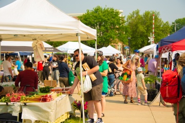 People shopping at a farmer's market in Madison