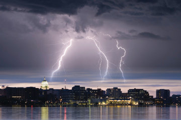 Madison skyline with a thunderstorm and lightning over Lake Monona.
