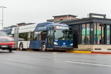 Electric bus pulling up to a BRT station