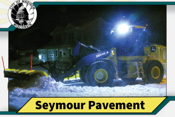 Trading card featuring Seymour Pavement, a yellow front-loader plow