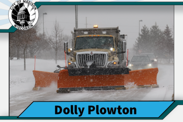 Trading card featuring Dolly Plowton, a large truck with a double-wing plow 