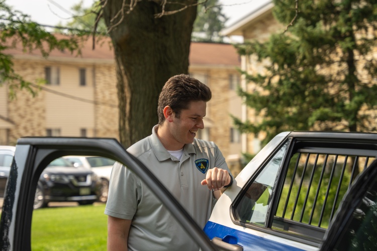 Madison police recruit gives squad car tour during National Night Out celebration.