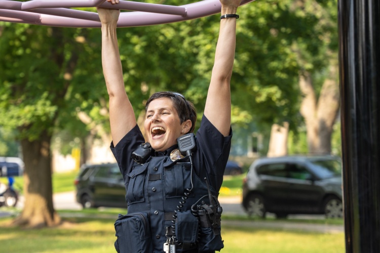 Madison officer hangs from playground equipment during National Night Out celebration
