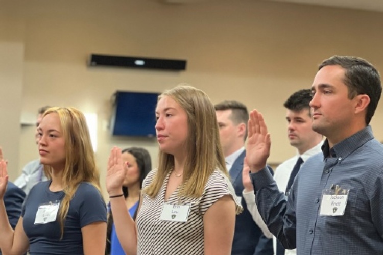 Recruits with the Madison Police Department's 71st Academy class take the oath of office.