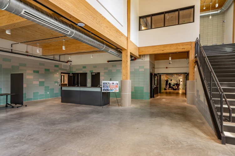 Entry way into the new men's shelter, showing the intake desk and main hallway
