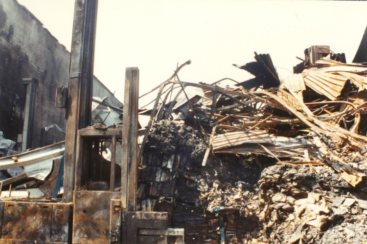 Forklift 3 amid the rubble from the fire