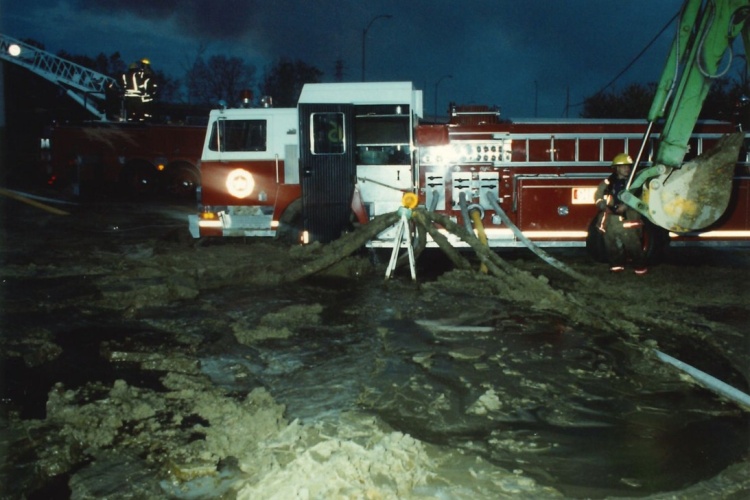 Ladder truck embedded in sea of sludge