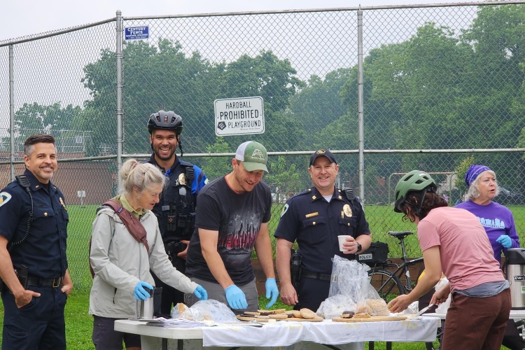 Officers partnered with Tenney Lapham Neighborhood Association to pass out bagels and coffee to cyclists as part of Madison's bike to work week