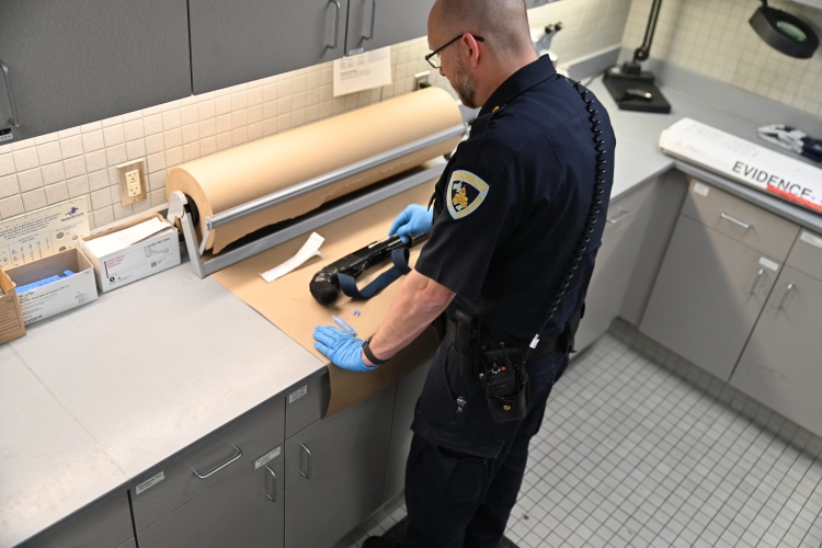 Investigator swabbing evidence