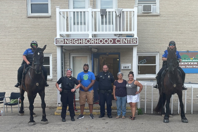 Mounted Patrol and other Officers with community members at BLW Neighborhood Center