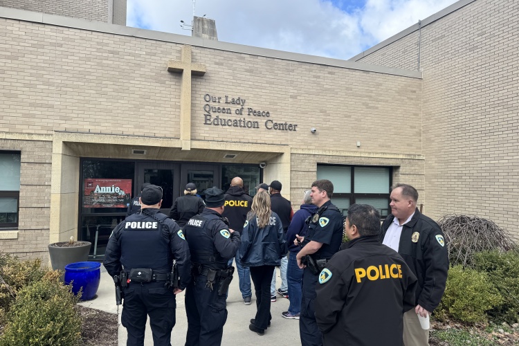 Midtown District officers take a tour of Queen of Peace school