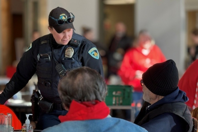 Officer Erickson engages with community members during a Police Be My Valentine community engagement initiative