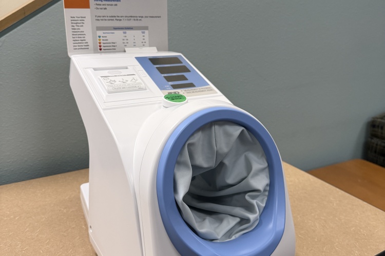 A portable blood pressure machine sitting on a table.