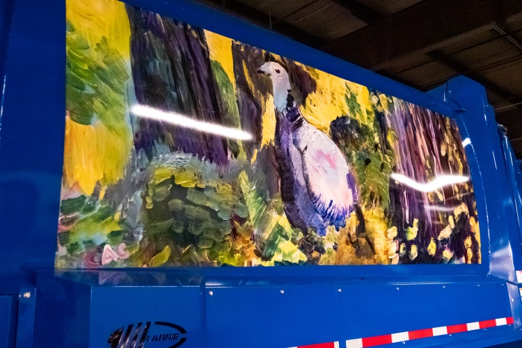 View of the truck mural of the turkey in a wooded area