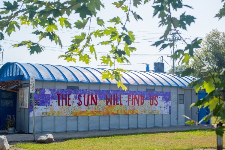 Artistic banner that says "the sun will find us"