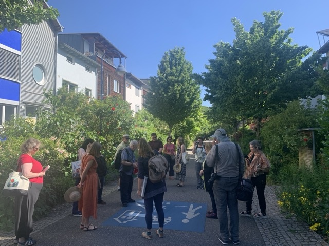 The Madison Freiburg delegation tkaing a tour in the Vauban neighborhood