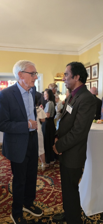 Badri Lankella with Governor Tony Evers