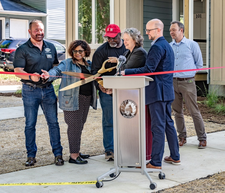 Mayor Satya Rhodes-Conway and Alder Barbara Harrington-McKinney cut the ribbon on new townhomes on Theresa Terrace