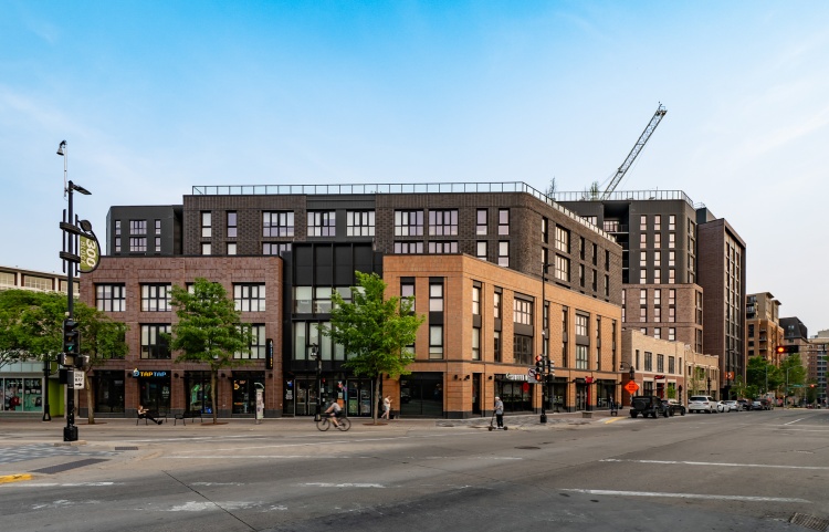 Construction crane behind an apartment building in downtown Madison