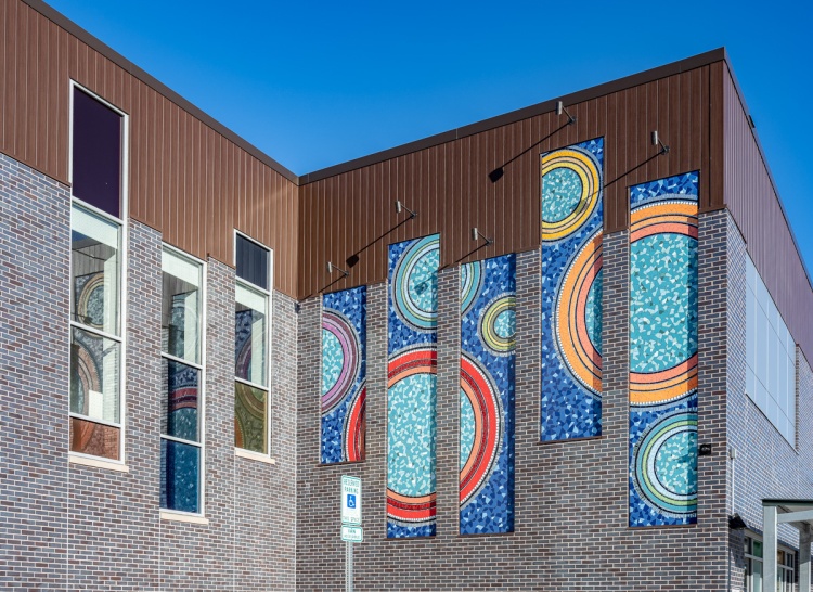 "Unity, Spirit, Community" mosaic installed on the exterior of the men's shelter