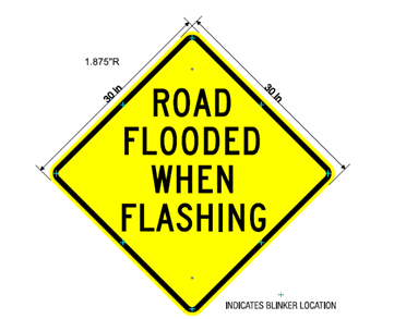 road flooded when flashing sign
