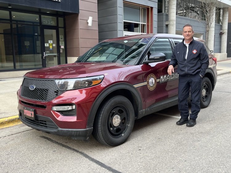 Paul Ripp standing next to his MFD vehicle