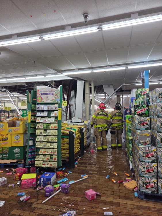 Members of the MFD HURT examine the damage