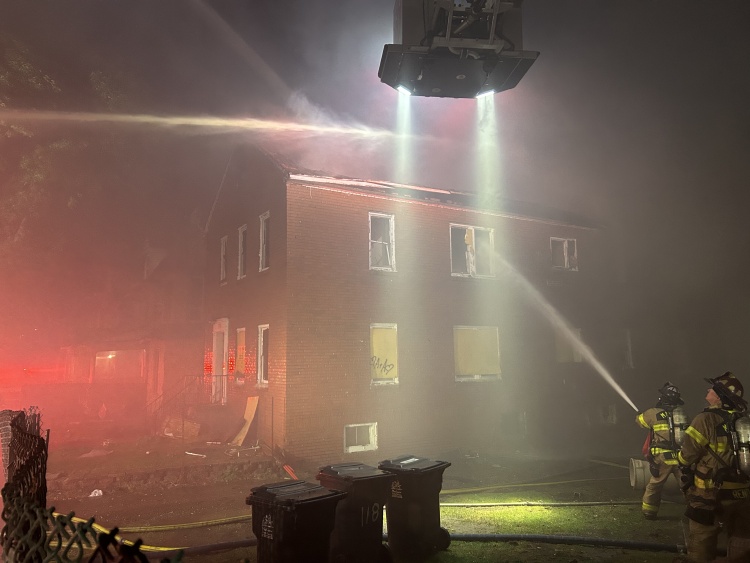 Firefighter attack the fire from outside the building using multiple water streams