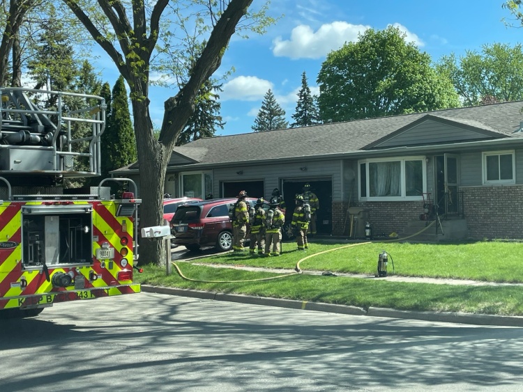 Fire truck staged in front of the home