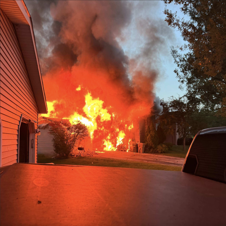 high flames and thick smoke coming from garage