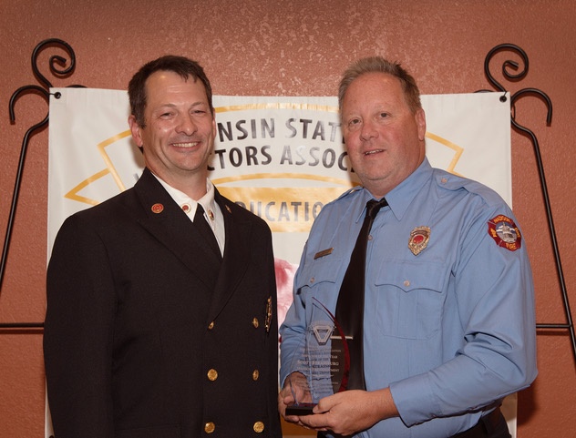 Fire Marshal Bill Sullivan and Code Enforcement Officer Scott Strassburg holding the award for State Fire Inspector of the Year