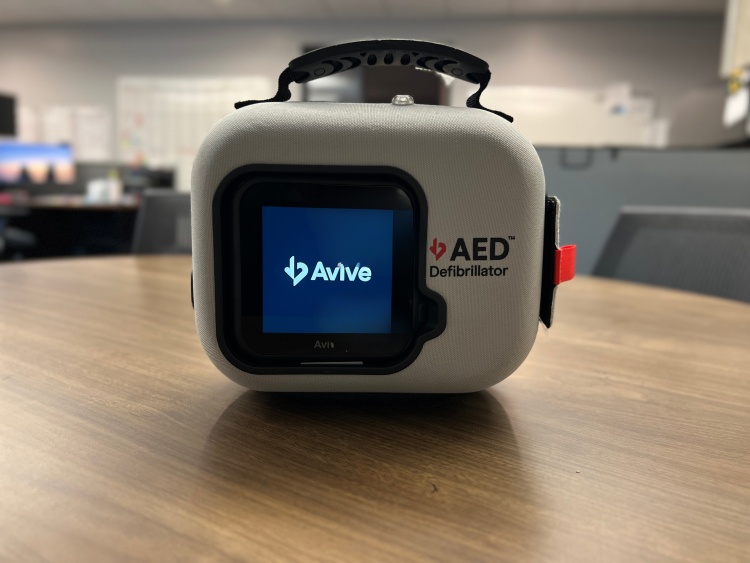 Avive AED resting on a table