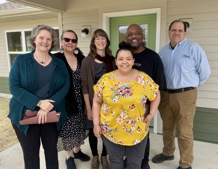 Mayor Rhodes-Conway and other officials outside of Elsa Floyd's new home