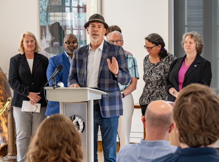 Alder Evers speaking at press conference